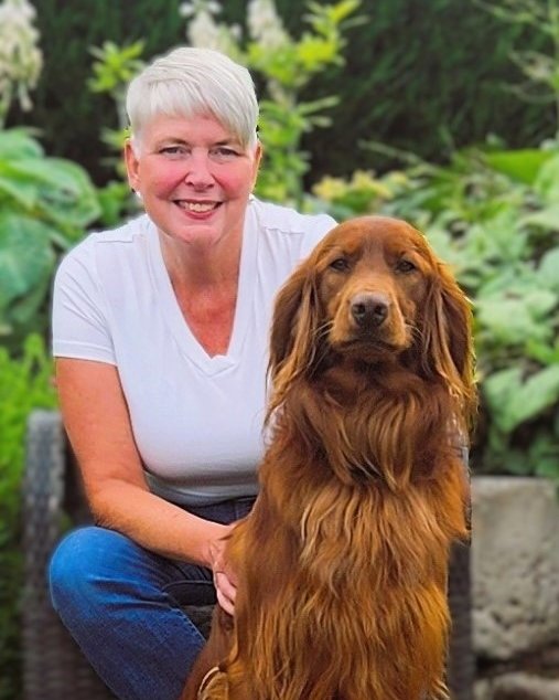 Wendy Kinloch with her dog in the garden